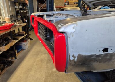 Front bumper tucked in
